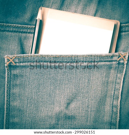 notebook and pencil in jean pocket retro vintage style