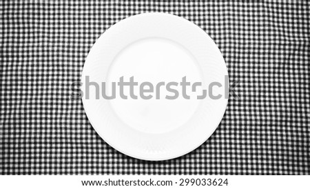 empty dish on kitchen towel background black and white color tone style