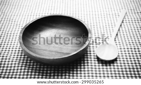 wood bowl and spoon  on kitchen towel background black and white color tone style
