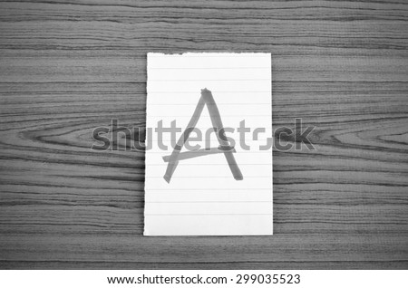 grade a on wood wall background black and white color tone style