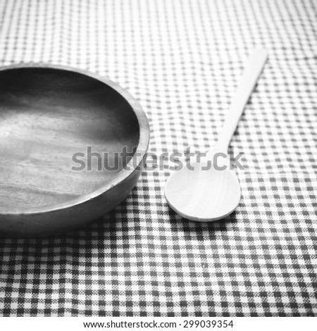 wood bowl and spoon on kitchen towel background black and white color tone style