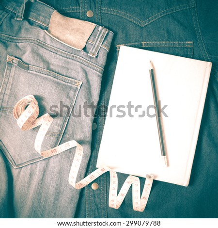 measuring tape and notebook with jean retro vintage style