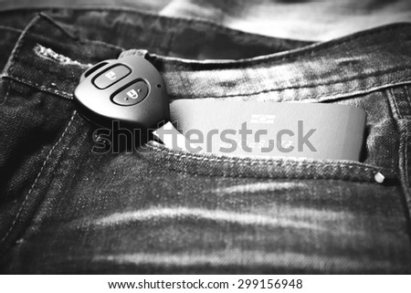 passport in jean pocket with car key black and white tone color style