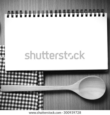 notebook and kitchen tools on table black and white color tone style