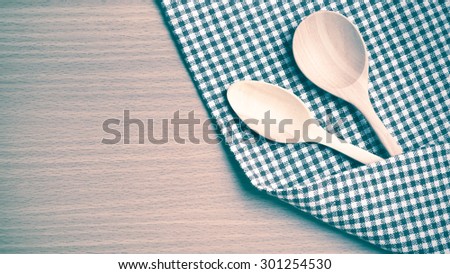 wood spoon and kitchen towel on table vintage style