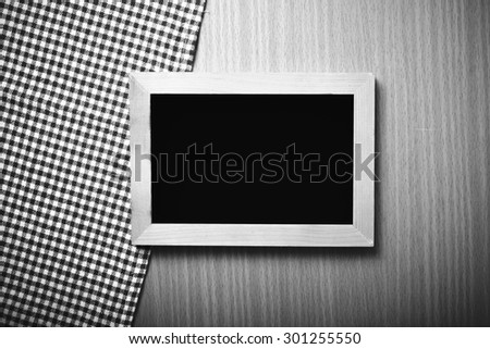 blackboard and kitchen towel on table black and white color tone style