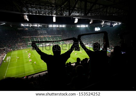 WROCLAW, POLAND - August 29:UEFA Europa League, Stadium with fans silhouettes on football match, Slask Wroclaw vs Sevilla on August 29, 2013 in Wroclaw, Poland.