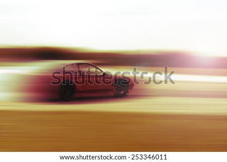 drift car motion blur sunrise or sunset