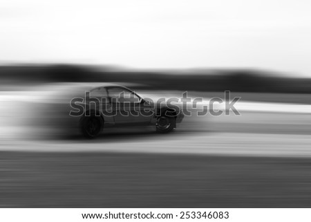 drift car motion blur on hard black and white