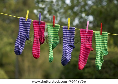 Bright striped socks on clothes line