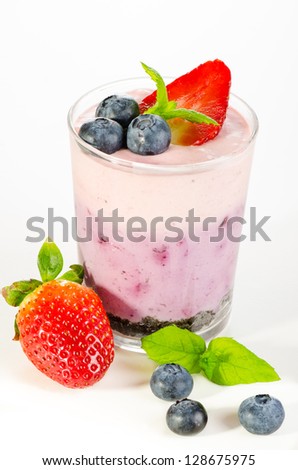 Fruit dessert with berries served in glass (berry cheesecake wit