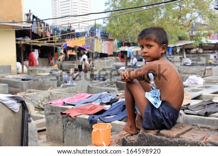 Mumbai, India - October 27, 2011: Dhobi Ghat Is A Well Known Open Air Laundromat In Mumbai, India. The Washers Work In The Open To Wash The Clothes From Mumbai\'S Hotels And Hospitals.