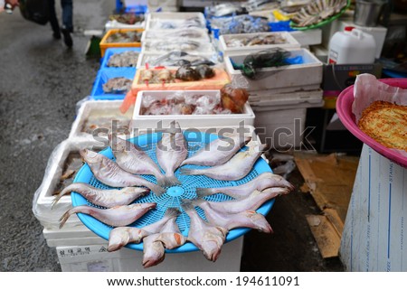 Seoul, South Korea - April 16, 2014: Fish Shop in the Namdaemun market. Namdaemun Market, located in the center of Seoul, is the biggest traditional market in Korea.