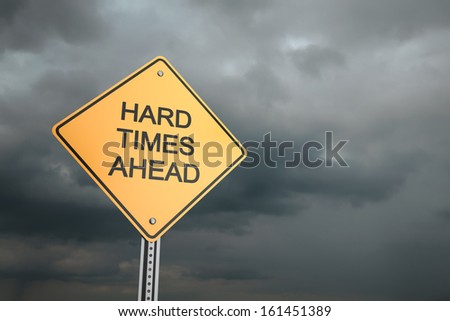 Yellow road warning sign , Hard Times Ahead