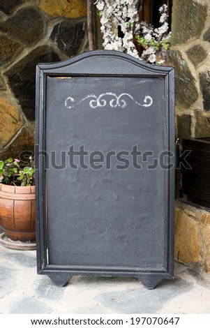 Empty old menu board stand at a restaurant
