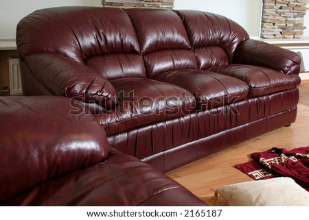 Brown leather furniture detail in exhibition room interior