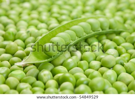 Fresh green peas vegetable closeup on seed background