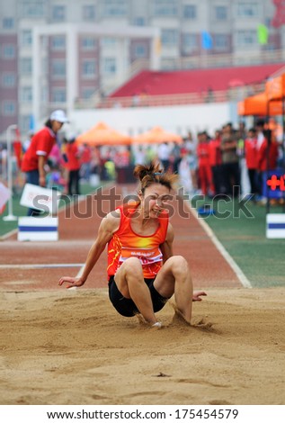 Xingtai City, Hebei Province - China, June 2012: Held on June 1, 2012 in Xingtai, China University Games, a female athlete in the triple jump worked hard.