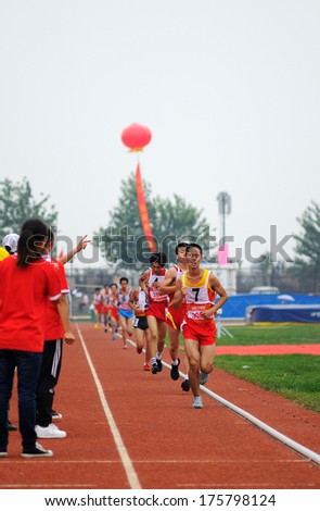 Xingtai City, Hebei Province, China - June 1, 2012: On June 1, 2012 Chinese University Games, in the men\'s 10,000 m race, the athletes worked hard on the runway.