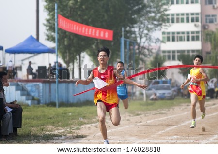 Baixiang County, Hebei Province, China - May 10, 2013. Baixiang County Middle School Track Meet held in May 10, 2013. Student athletes worked hard toward the finish line.