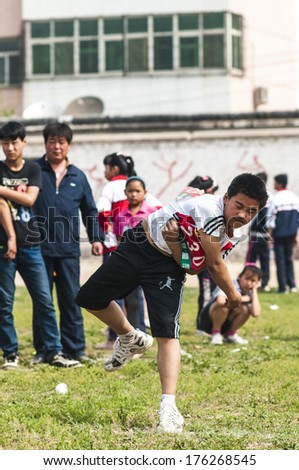 BAIXIANG COUNTY, HEBEI PROVINCE, CHINA - MAY 2013: Baixiang County May 14, 2013 Students track meet was held. Student Games Throwing venues, student athletes worked hard for the best results.