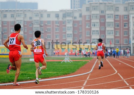 XINGTAI CITY, HEBEI PROVINCE, CHINA - June 2012: On June 1, 2012 Chinese University Games, in the men\'s 10,000 m race, the athletes worked hard on the runway.