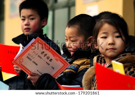 XINGTAI CITY, HEBEI PROVINCE, CHINA - MAR 2, 2012 In the March 2, 2012, a school for students winning awards and certificates. The award-winning unidentified students are very happy and proud.