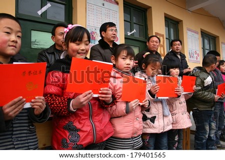 XINGTAI CITY, HEBEI PROVINCE, CHINA - MAR 2, 2012:  In the March 2, 2012, a school for students winning awards and certificates. The award-winning unidentified students are very happy and proud.