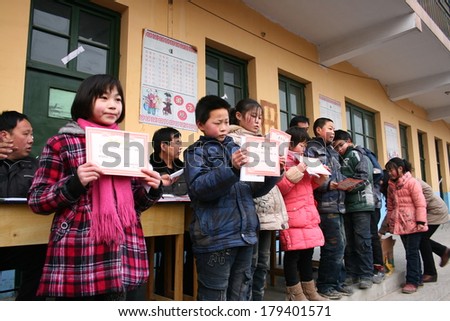 XINGTAI CITY, HEBEI PROVINCE, CHINA - MAR 2, 2012:  In the March 2, 2012, a school for students winning awards and certificates. The award-winning unidentified students are very happy and proud.