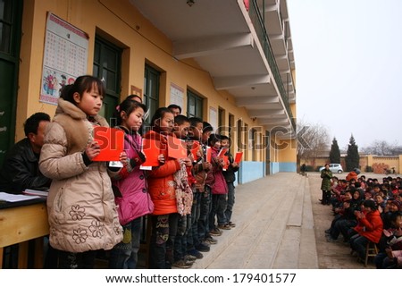 XINGTAI CITY, HEBEI PROVINCE, CHINA - MAR 2, 2012  In the March 2, 2012, a school for students winning awards and certificates. The award-winning unidentified students are very happy and proud.
