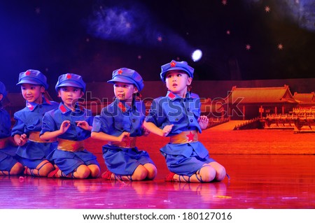 SHIJIAZHUANG CITY, CHINA - JULY 7: On July 7, 2012 in Shijiazhuang City, China Youth Arts Festival Unidentified group of cute kids performing dance modern Chinese revolution.