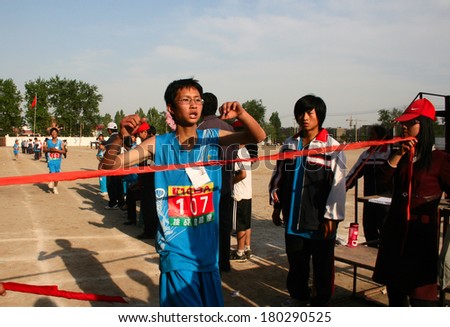 Baixiang County, China - May 12, 2011: Baixiang County Middle School Track Meet held in May 12, 2011. Unidentified Student athletes worked hard toward the finish line.