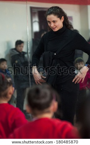 BAIZING, CHINA- JAN 15, 2014, Baixiang County Youth Center has invited foreign teachers to teach Latin dance. Unidentified teachers and students happy in the enjoyment of learning.