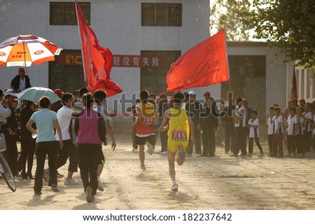 Baixiang County, China - May 12, 2011: Baixiang County Middle School Track Meet held in May 12, 2011. Unidentified Student athletes worked hard toward the finish line.