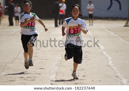 Baixiang County, China - May  12: Baixiang County Middle School Track Meet held in May 12, 2011 Unidentified Student athletes worked hard toward the success.