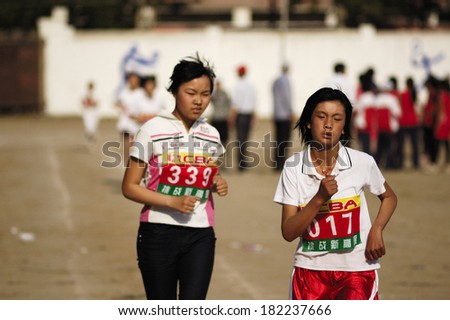 Baixiang County, China - May  12: Baixiang County Middle School Track Meet held in May 12, 2011 Unidentified Student athletes worked hard toward the success.