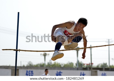 Xingtai City, China - May 12: In May 12, 2011, baixiang County Middle School Games were held. Unidentified student athletes in the high jump worked hard to win the game.