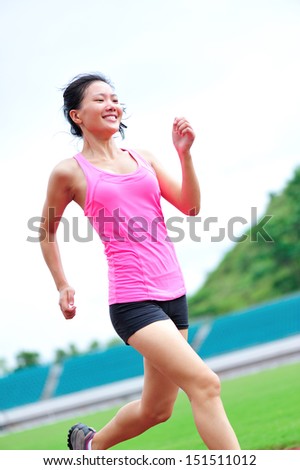 asian woman runner running in the playground outdoor