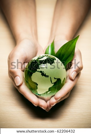 glass globe in hand glass globe in hand