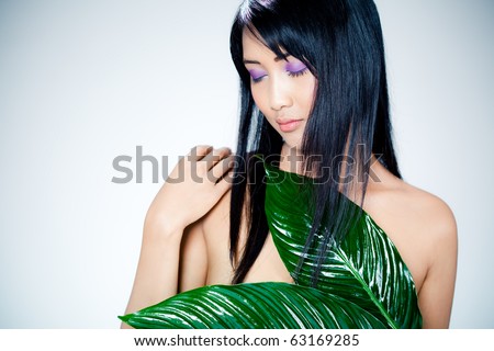 beautiful asian woman and leaves