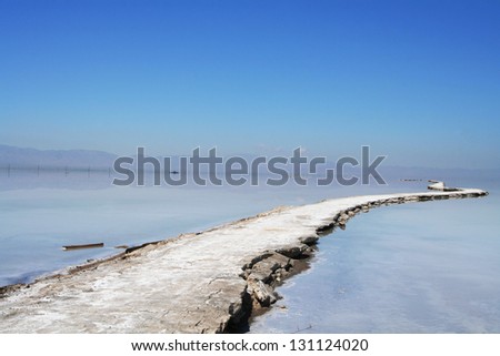 Winding salt road though Caka Salt Lake
