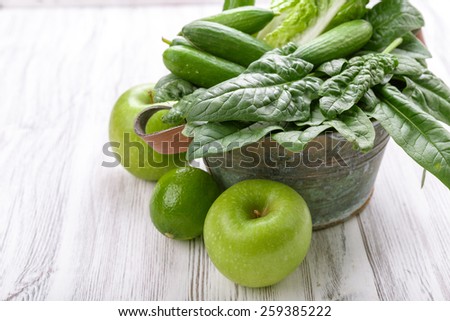 Green vegetables in a basket on a background