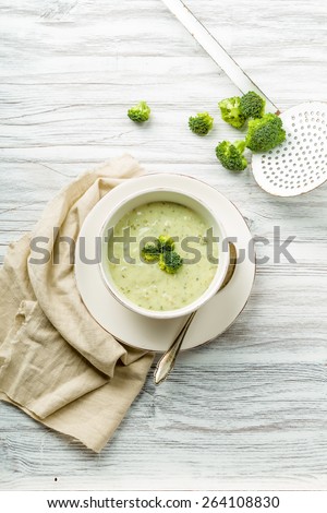 fresh broccoli soup with croutons and herbs