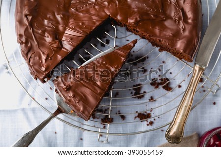 Chocolate cake cut into several pieces with decoration