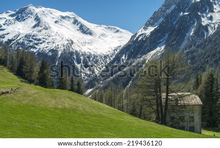 alone house and alpine landscape