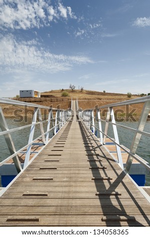 Wooden walkway serving Amieira pier on the banks of the reservoir of Alqueva, Alentejo, Portugal
