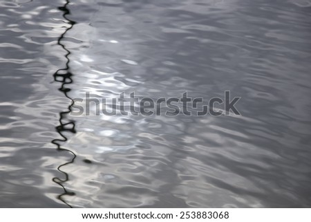 Silver silky smooth lake surface (Lake Orta, Italy)