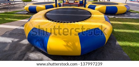 Yellow blue strip trampoline set in the amusement park