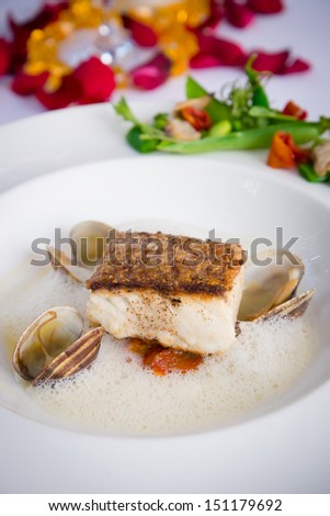 Parrot fish with sweet tomatoes green peas food in Italian style