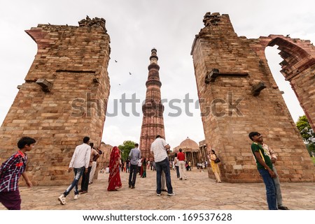 NEW DELHI - AUGUST 11, 2013 : People travel visiting in Qutub Minar,August 11, 2013 in New Delhi, India.